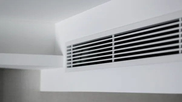 Close view of a concealed unit grille in a bulkhead